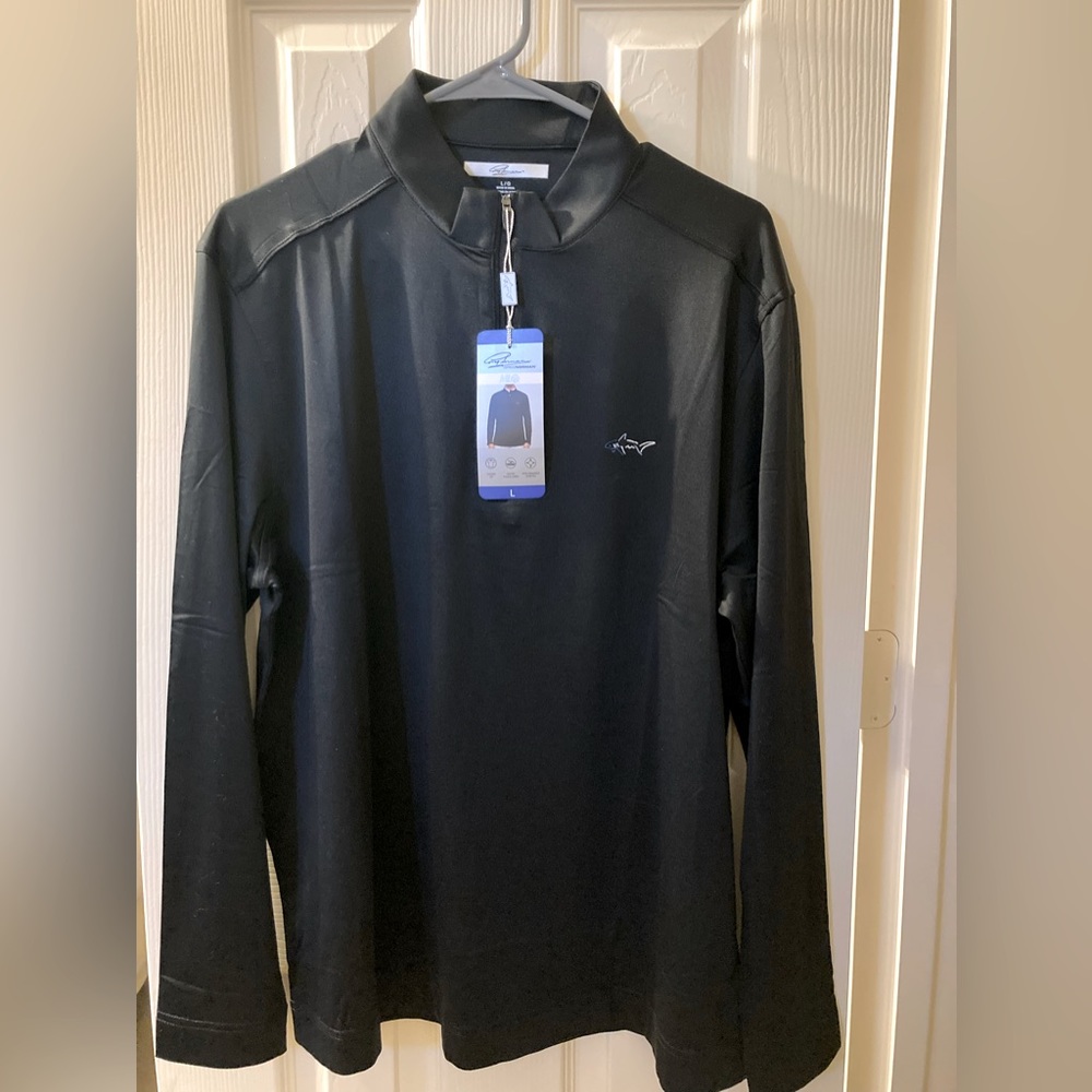 Greg Norman 1/4 Zip, Dry-fit feel, micro fleece lined for premium comfort.